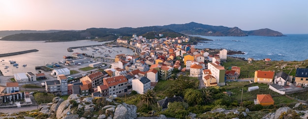 Panoramic view at sunrise of the fishing village of Muxia in Galicia