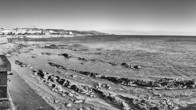 Panoramic view at sunset from the historic ramparts, one of the main sightseeing in Alghero, famous center and holiday resort in northwestern Sardinia, Italy