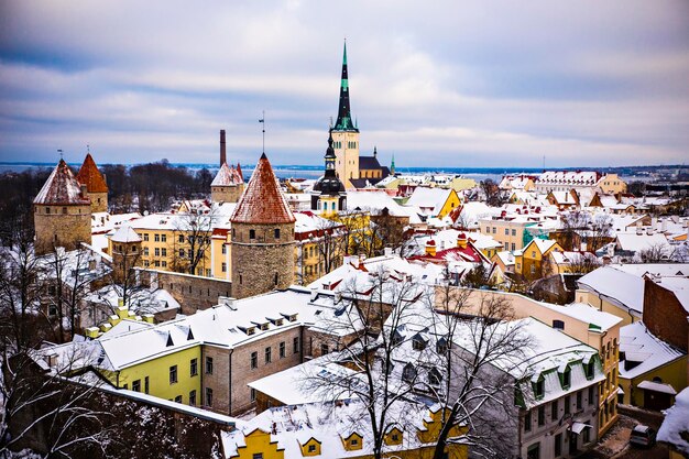 Panoramic view of Tallinn old town on cloudy winter day. Tallinn roofs covered with snow, Old town T