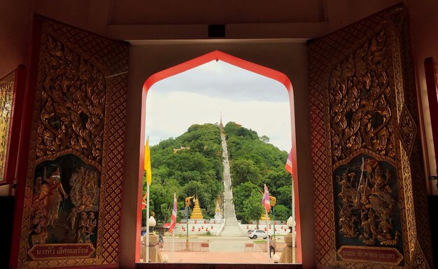 Panoramic view of temple and building seen through entrance