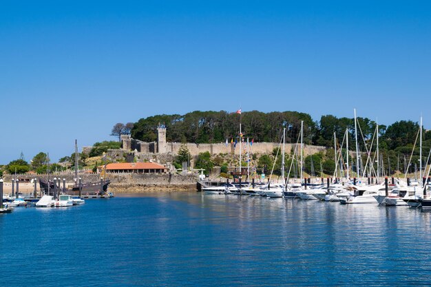 Panoramic view of the tourist parador of baiona seen from the sea galicia - spain