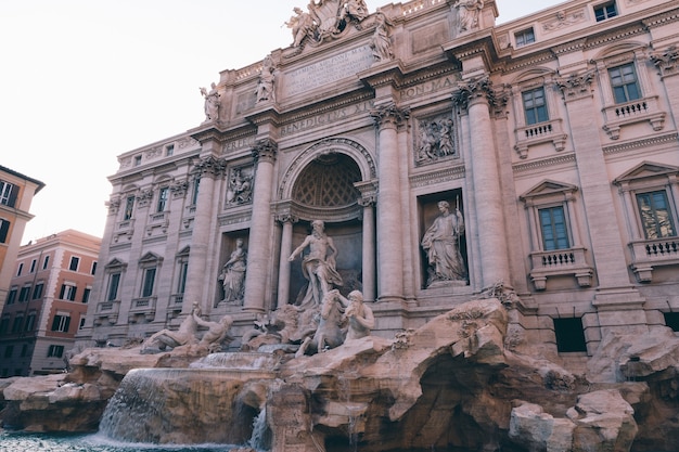 Panoramic view of Trevi Fountain in the Trevi district in Rome, Italy. It designed by Italian architect Nicola Salvi and completed by Giuseppe Pannini