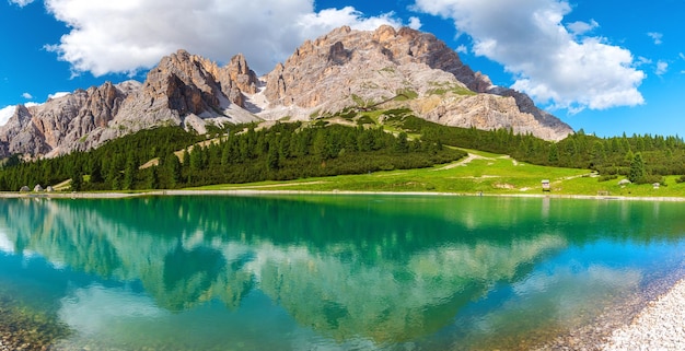 Panoramic view of turquoise water alpine lake in Dolomites mountains Italy Lago Son Forca in Italian Alps in sunny day