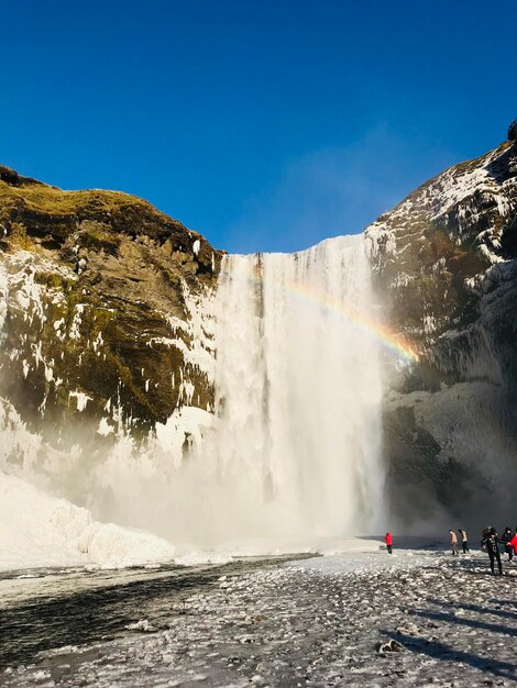 Panoramic view of waterfall against sky