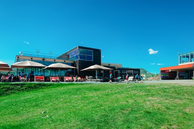 Panoramic view with cable car station in mountains and blue sky in Bad Kleinkirchheim, Carinthia of Austria. Austrian hills and green valleys. Nature outdoor landscape. Travel and tourism in summer.