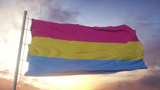 Pansexuality pride flag waving in the wind, sky and sun background. 3d rendering