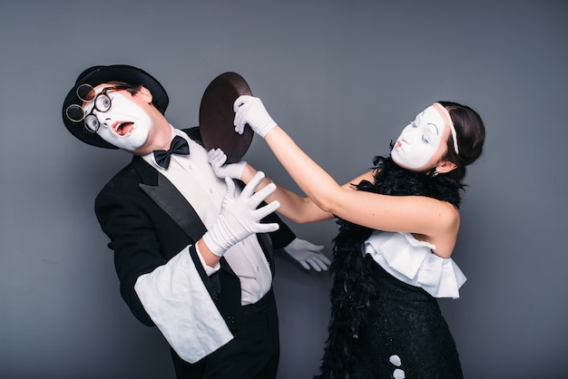 Pantomime theater performers with frying pan. Mime actors comedy performing