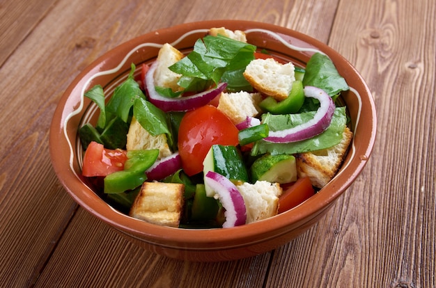 Panzanella or panmolle is a Tuscan salad of bread and tomatoes