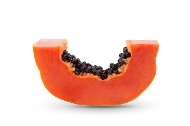 Papaya, cut into pieces isolated on white.