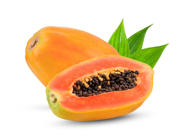 Papaya fruit with seeds on white wall