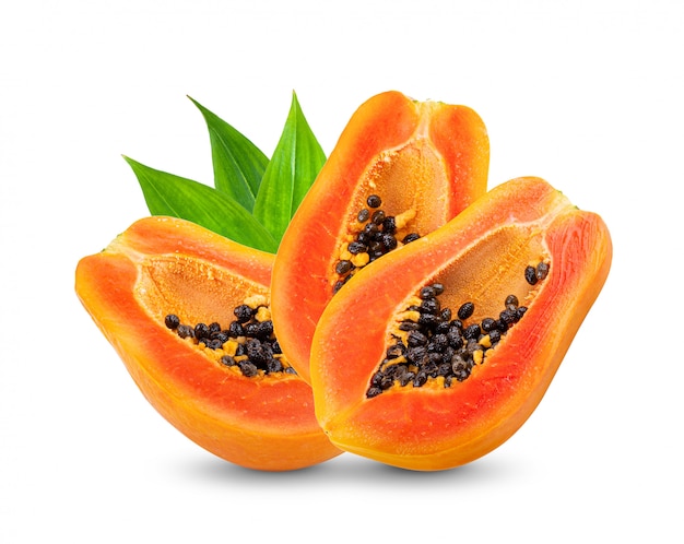 Papaya fruit with seeds on white wall