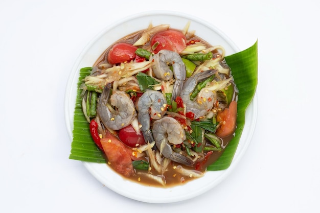 Papaya salad with shrimp in white plate