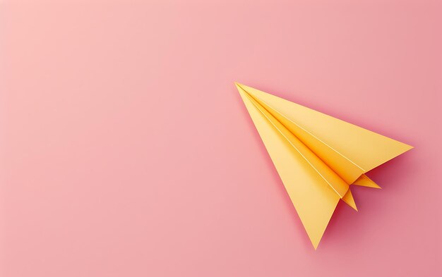 a paper airplane is on a pink background