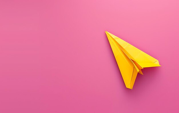 a paper airplane with a yellow triangle on the top