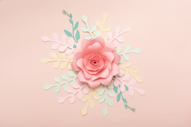 Photo paper art pink background with flowers and tropical leaves. fashion floral greeting card.