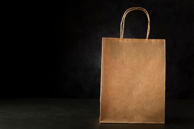 Paper bag on dark background Texture for Black Friday