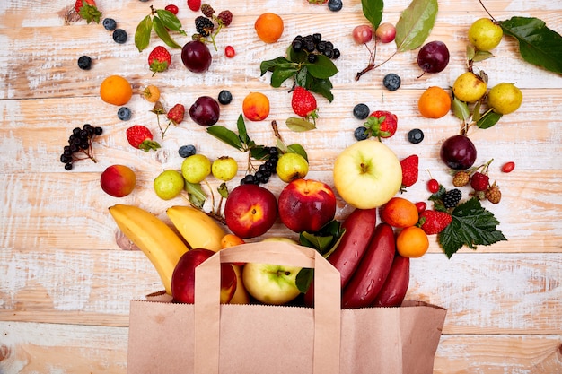 Paper bag of different health fruits food