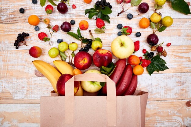 Paper bag of different health fruits food