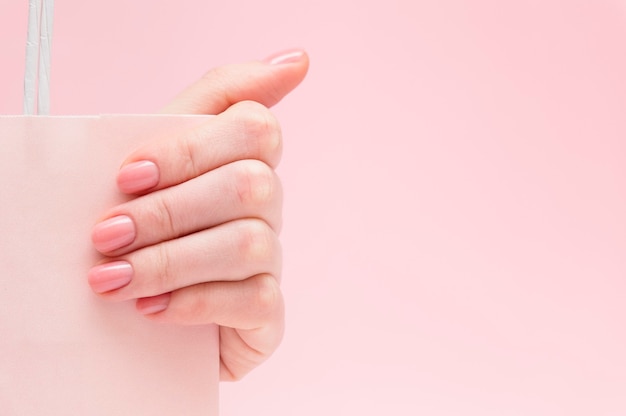 Paper bag in female hand