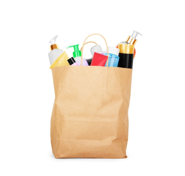 Paper bag with cosmetics on a white background