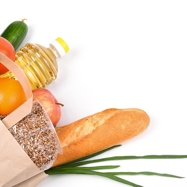 Paper bag with food supplies for the period of quarantine isolation on a white