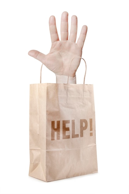 Paper bag with a hand and word Help