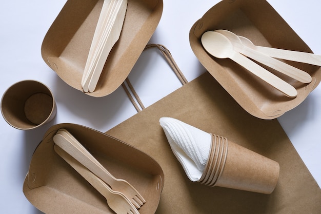 Paper bag with a picnic set plate fork glass