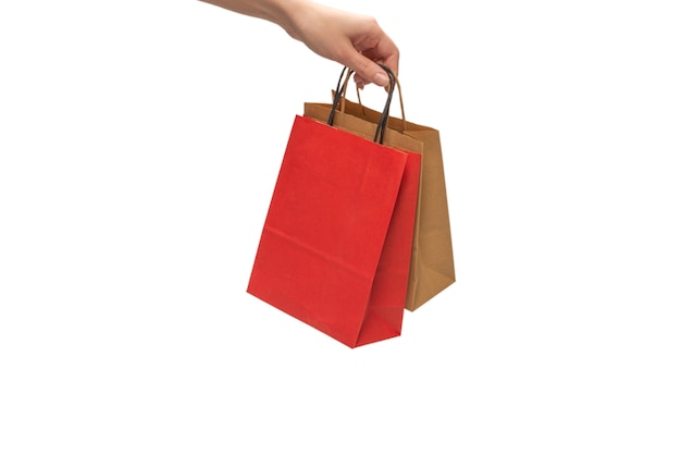 Photo paper bag in woman hands isolated on white