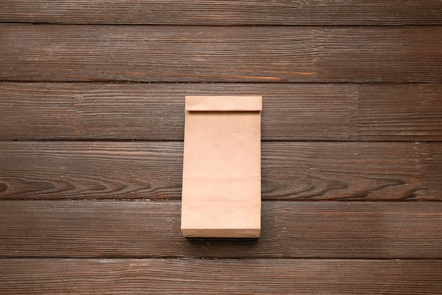 Paper bag on wooden table