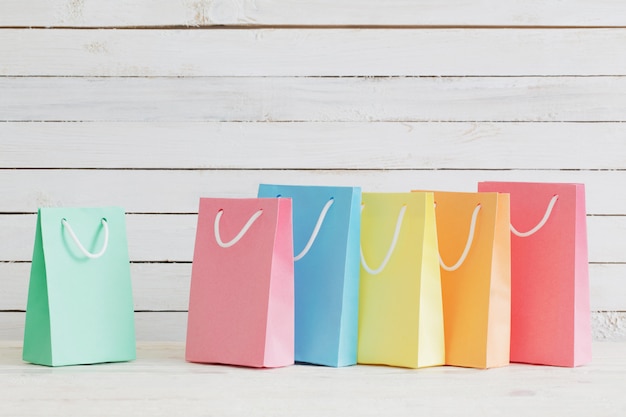 Paper bags on wooden wall