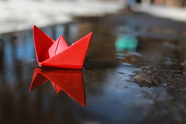 Paper boat in a pool