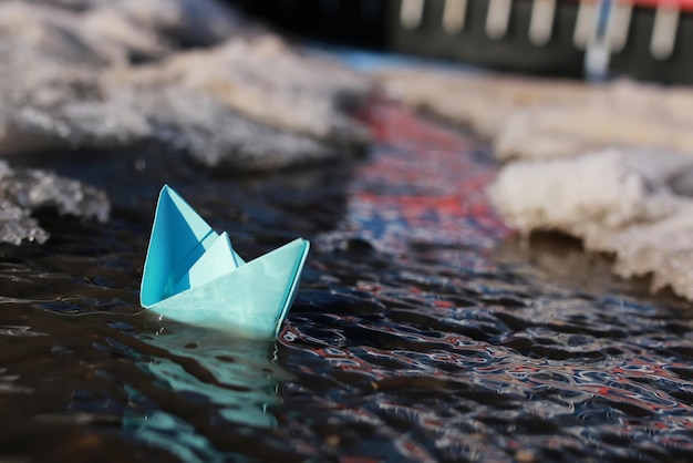 Paper boat in a pool