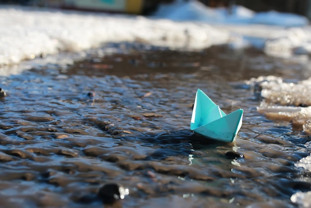 Paper boat in a pool