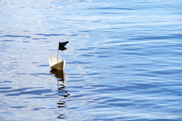 Paper boat on the water