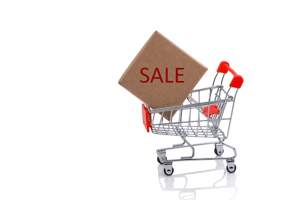 Paper box in a shopping cart with red sale sign