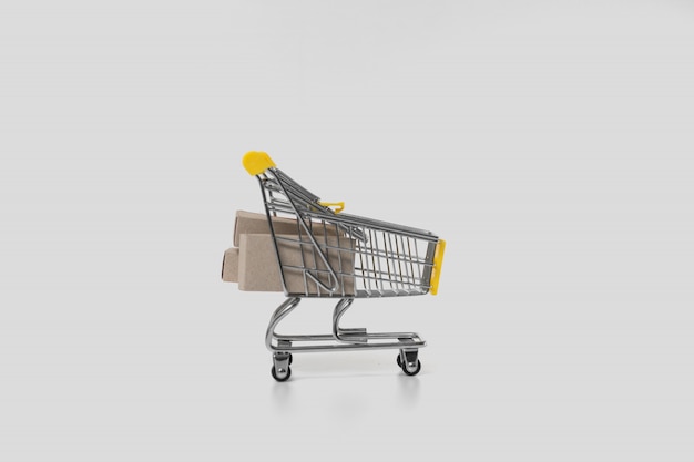 Paper boxes in trolley on white background