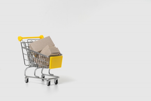 Paper boxes in trolley on white background