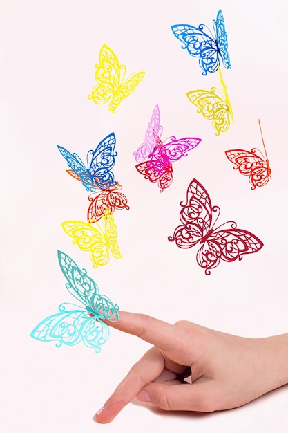 Paper butterflies fly out of girl's hands