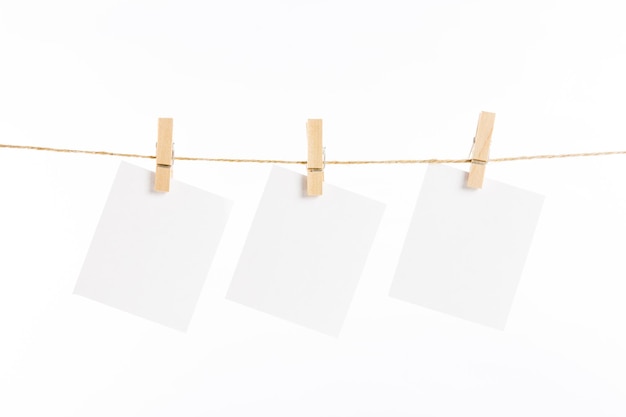 Paper cards hanging rope isolated