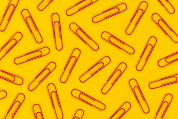 Paper clips on yellow background Top view Flat lay
