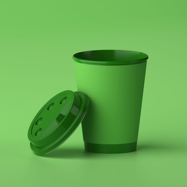 Фото Бумажная кофейная чашка 3d дизайн макет зеленая чашка на зеленом фоне