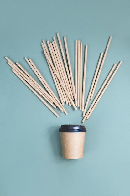 Photo paper coffee cups with paper straw splash. eco friendly design. zero waste