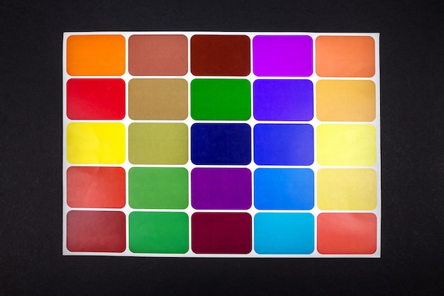 Photo paper colored catalog on an isolated black background color selection color palette