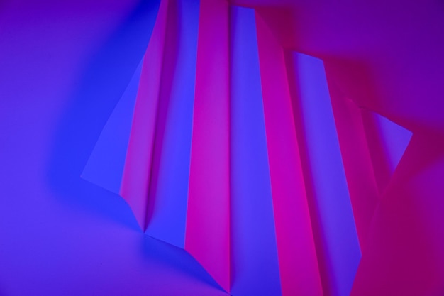 Paper colored with blue and pink light as an abstract background