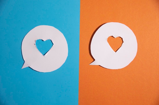 Paper cut heart on the orange and blue background
