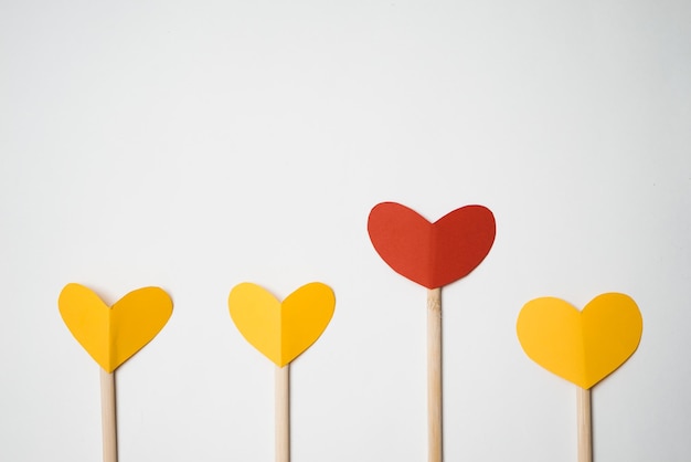 Paper cut hearts made by hands, frame