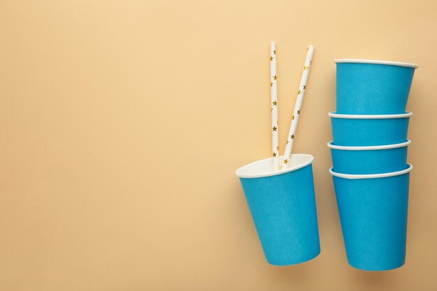 Paper disposable cup on beige background