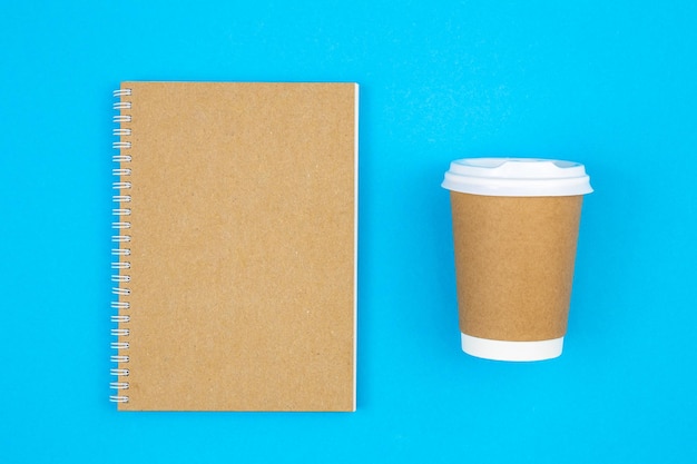 Paper disposable cup and notepad made from recycled paper cups top view