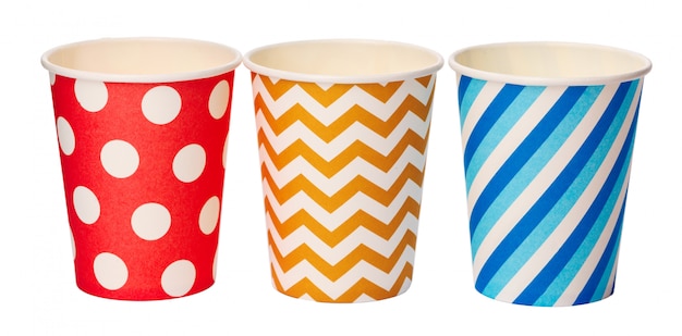 Paper disposable cups with colored pattern isolated on white 