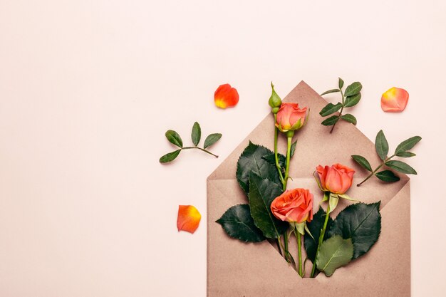 Paper envelope with mini coral roses. Tinted.